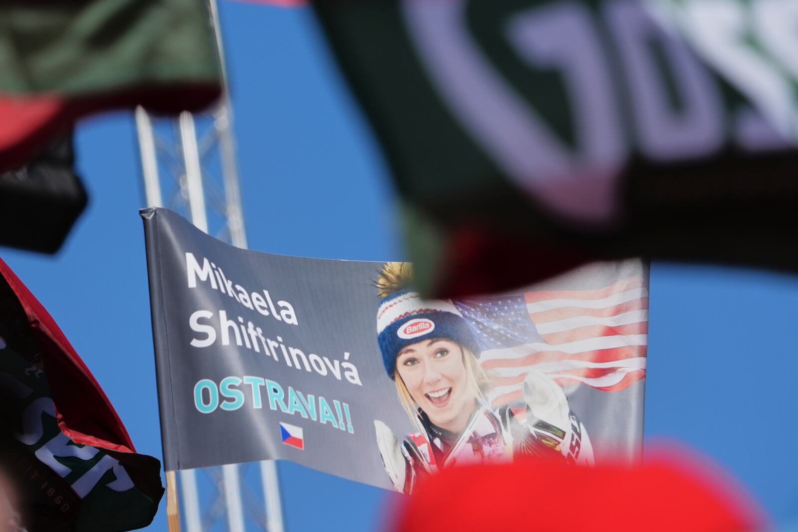 Fans from the Czech Republic wave a flag in support of United States' Mikaela Shiffrin at the finish area of a women's slalom, at the Alpine Ski World Championships, in Saalbach-Hinterglemm, Austria, Saturday, Feb. 15, 2025. (AP Photo/Giovanni Auletta)