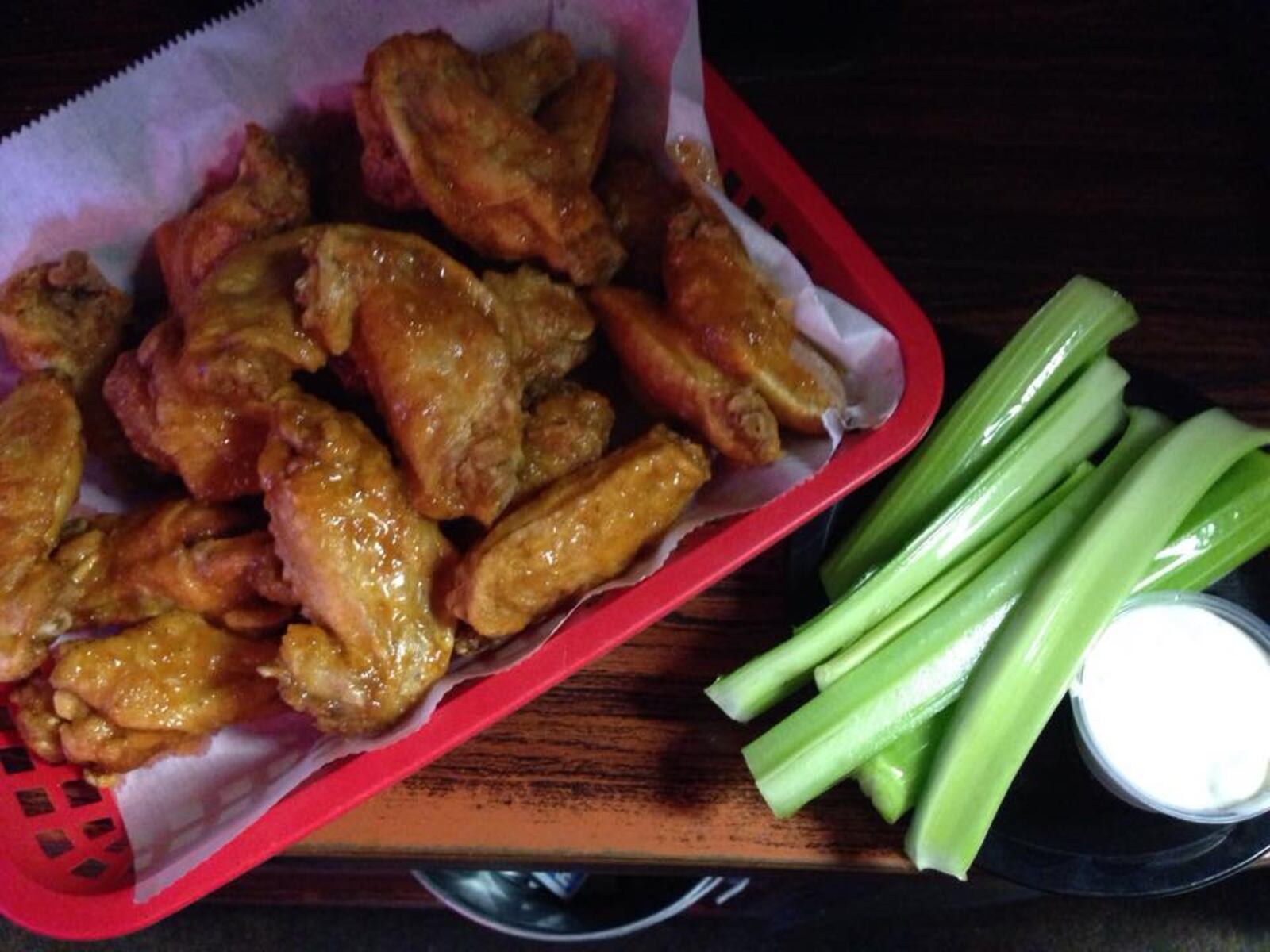 Wednesdays are the perfect day to grab wings like these BBQ ones from McIntosh Pub. Their dry rub wings are also amazing. (Source: Facebook)