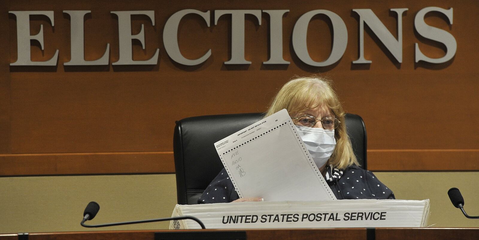 Montgomery County Board of Elections member Kay Wick looks over ballots Monday to certify the results of the primary election. MARSHALL GORBYSTAFF