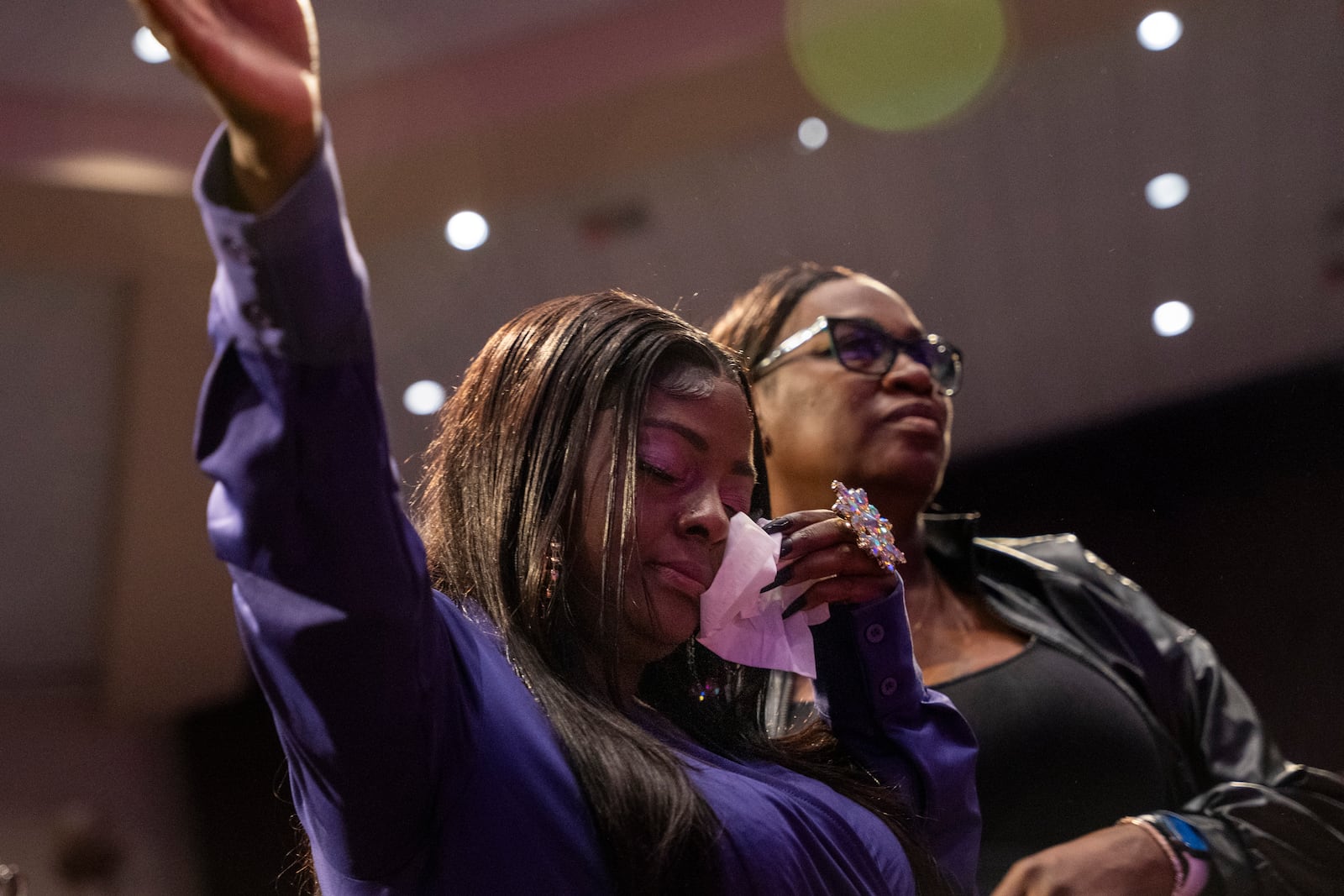 Diamond, daughter of Angie Stone, is supported through tears at her mother's memorial service, Friday, March 14, 2025, in Austell. Ga. (AP Photo/Olivia Bowdoin)