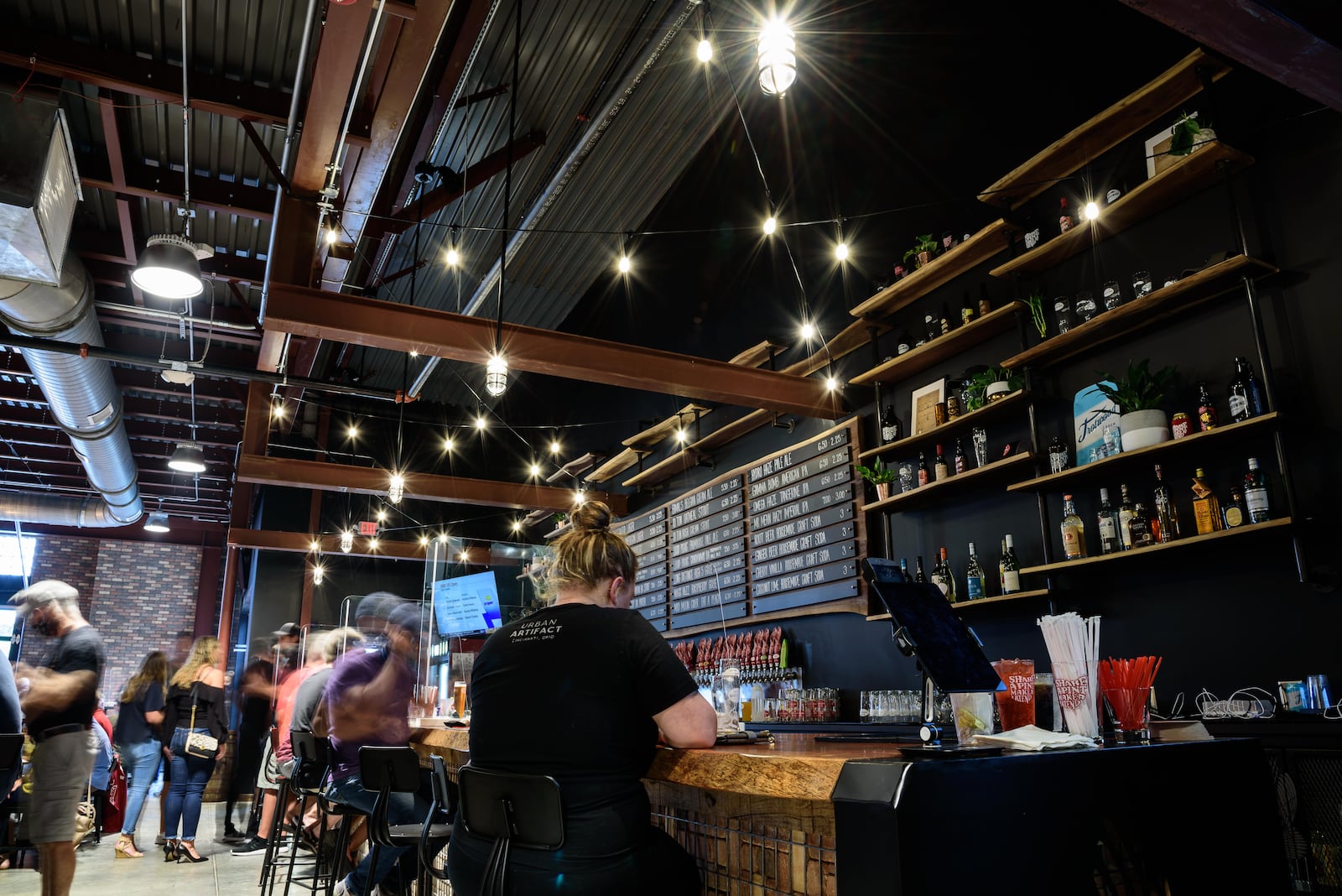 Here's a look at the soft opening of the Warped Wing Barrel Room & Smokery in Springboro on Friday, August 28, 2020. Located on the corner 73 and 741 in the new mixed-use Wright Station development by Synergy & Mills Development, this is Warped Wing Brewing Company's second location. TOM GILLIAM/CONTRIBUTING PHOTOGRAPHER