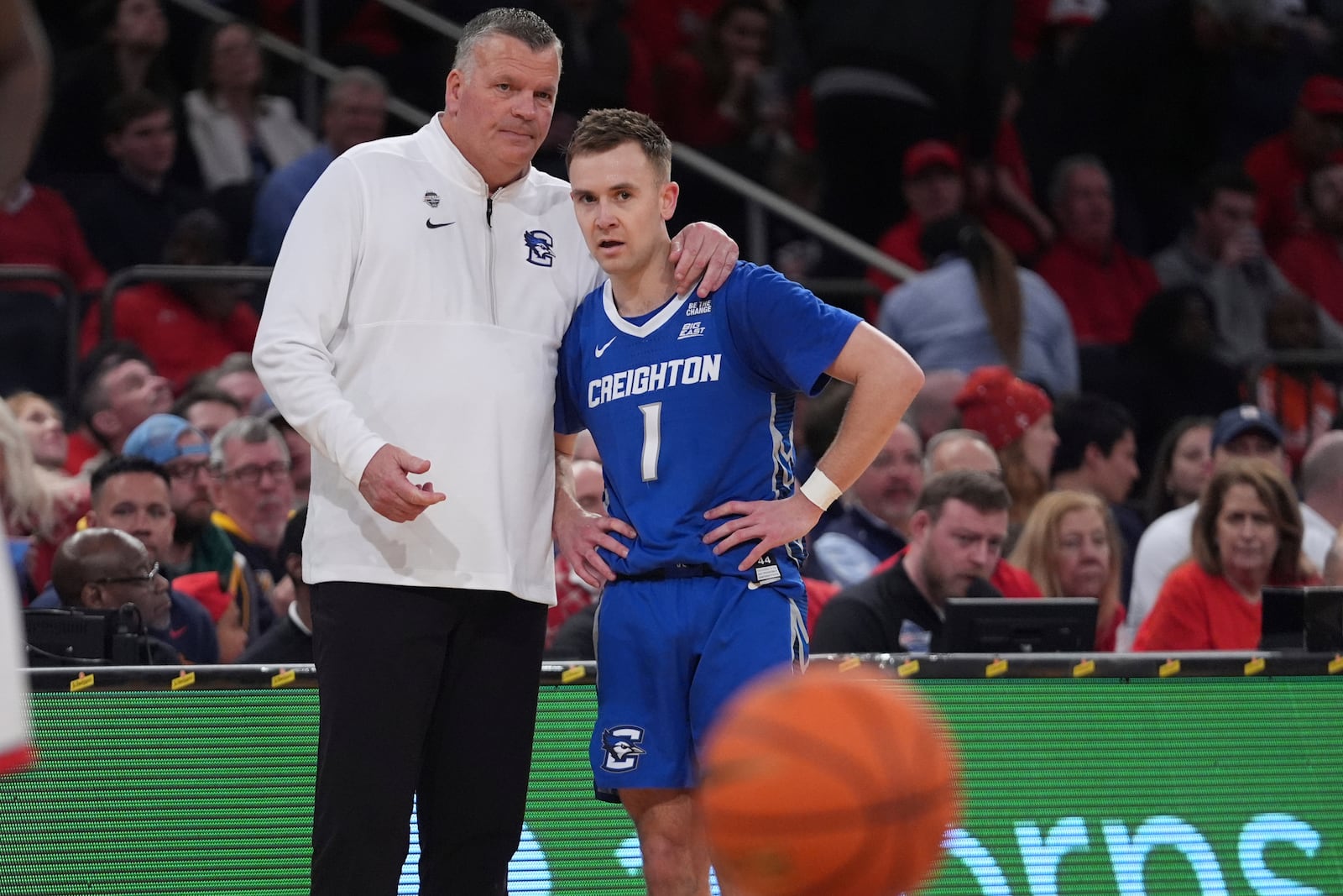 Creighton head coach Greg McDermott, left, talks to Steven Ashworth (1) during the second half of an NCAA college basketball game against the St. John's in the championship of the Big East Conference tournament Saturday, March 15, 2025, in New York. (AP Photo/Frank Franklin II)