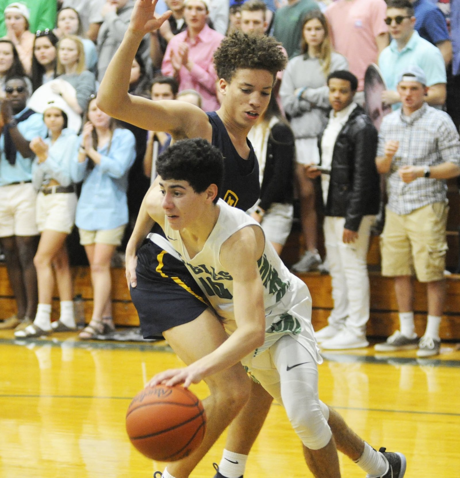 CJ’s John Nauseef (with ball) works around defender Max Land. CJ lost to visiting Cin. Moeller 62-55 in a boys high school basketball game on Sat., Feb. 2, 2019. MARC PENDLETON / STAFF