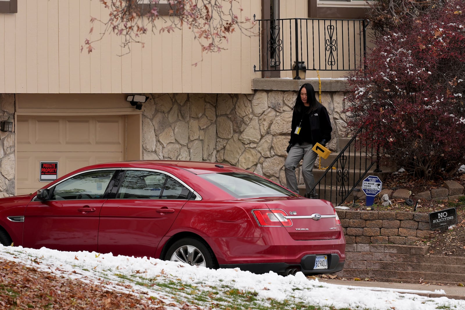 Police work the scene at the home of former police detective Roger Golubski on Monday, Dec. 2, 2024, in Edwardsville, Kan. (AP Photo/Charlie Riedel)