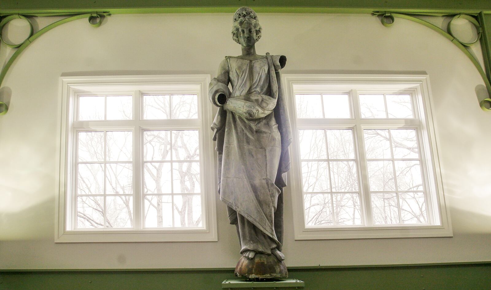 A piece of Dayton history has found a new home at Carillion Historical Park. Lady Mayfair, an 1879 zinc statue that once sat atop Dayton's Mayfair Theater, has been installed overlooking the Dayton Carousel of Innovation in the park's Heritage Center. STAFF PHOTO JIM NOELKER