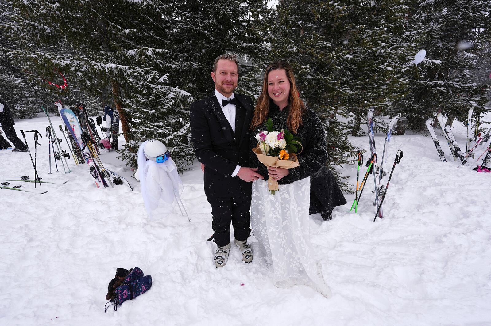 Alex Frank and Allie Bamber of Arvada, Colo., prepare for their wedding during the 35th annual Marry Me & Ski for Free Valentine's Day mountaintop matrimony ceremony Friday, Feb. 14, 2025, at Loveland Ski Area, Colo. (AP Photo/David Zalubowski)