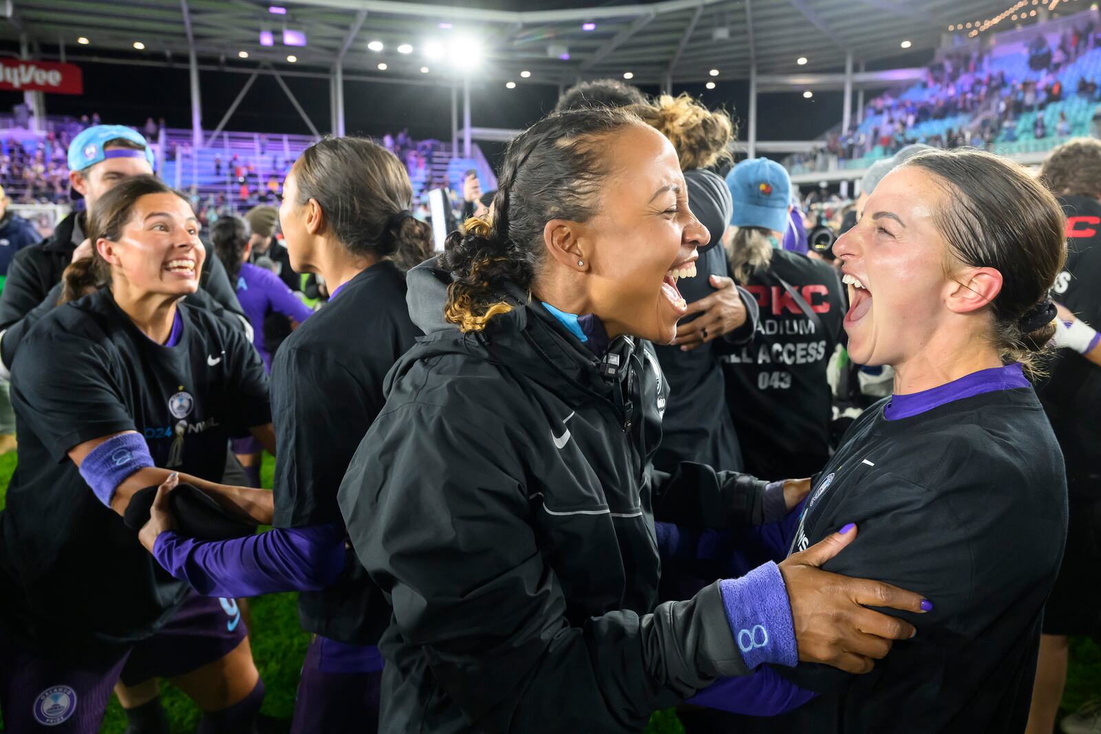 Orlando Pride team members celebrate after they defeated the Washington Spirit in the NWSL championship soccer game at CPKC Stadium, Saturday, Nov. 23, 2024, in Kansas City, Mo. (AP Photo/Reed Hoffmann)