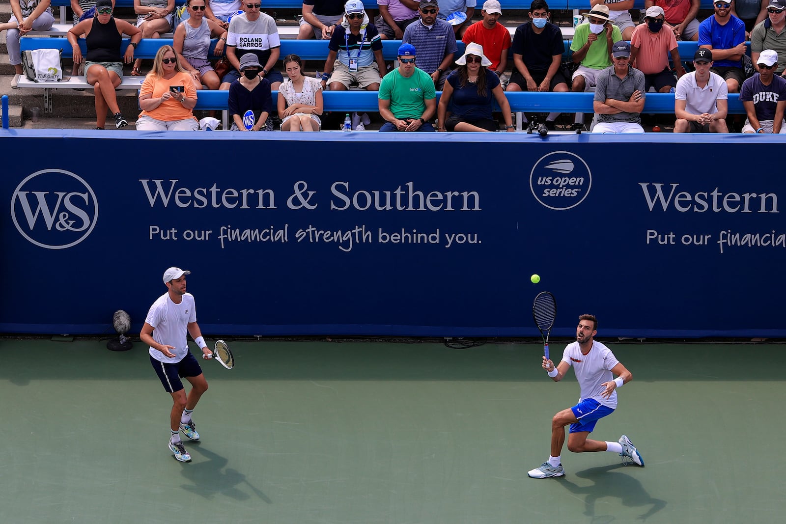 Marcel Granollers, right, of Spain, and Horacio Zeballos, left, of Argentina, play Steve Johnson and Austin Krajicek during the men's double final of the Western & Southern Open tennis tournament Sunday, Aug. 22, 2021, in Mason, Ohio. (AP Photo/Aaron Doster)