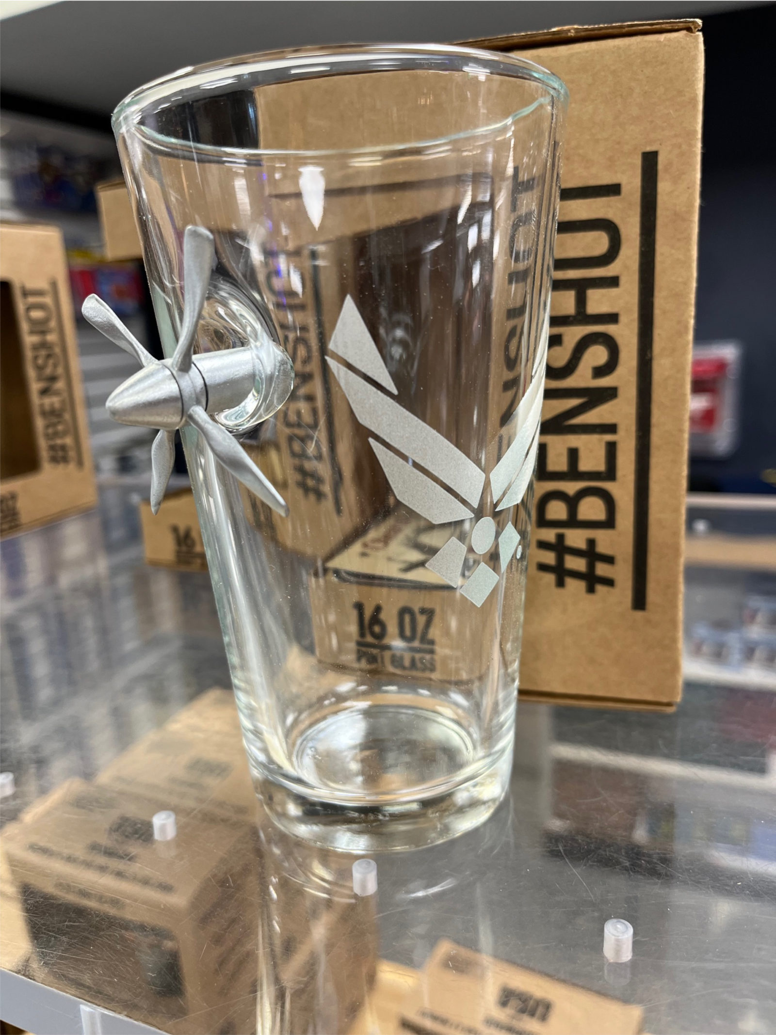 The Air Force Propeller Pint Glass has a propeller lodged into the side. Available at The Museum Store at the National Museum of the United States Air Force