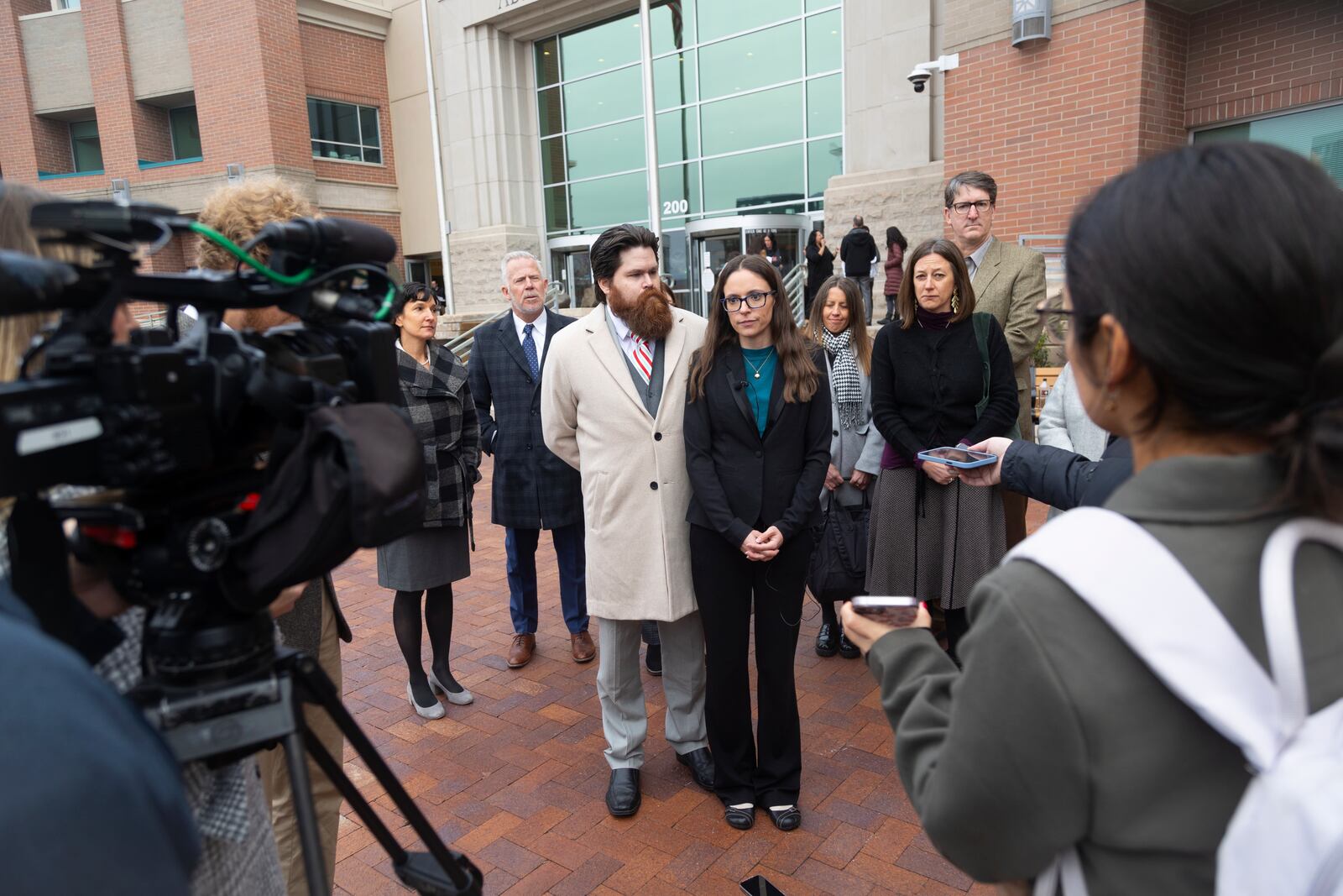 FILE - Jennifer Adkins and her husband, John, from Caldwell, Idaho talk to the media outside the Ada County Courthouse, Dec. 14, 2023, in Boise, Idaho. (AP Photo/Kyle Green, File)