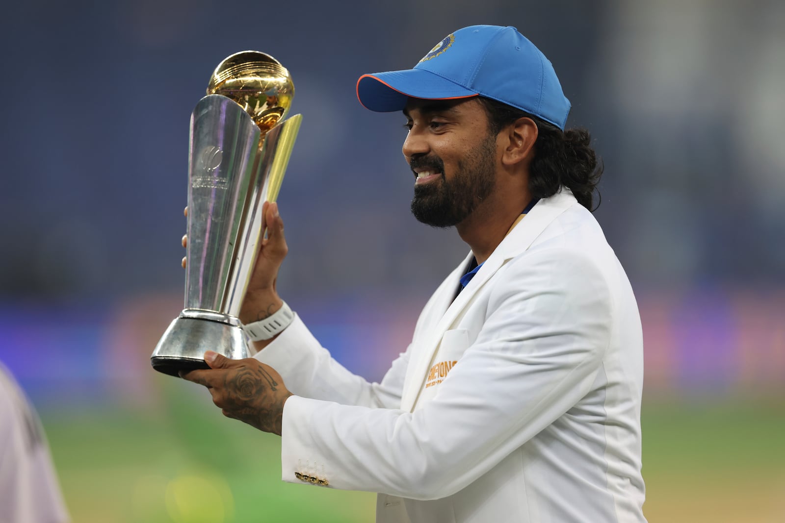 India's KL Rahul poses with the winners trophy after defeating New Zealand in the final cricket match of the ICC Champions Trophy at Dubai International Cricket Stadium in Dubai, United Arab Emirates, Sunday, March 9, 2025. (AP Photo/Christopher Pike)