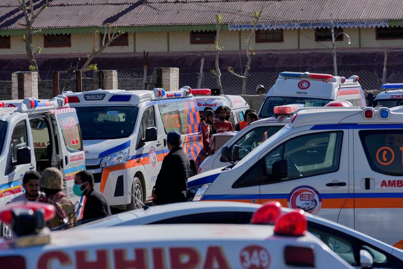 Ambulances wait for the arrival of the bodies of victims from a passenger train attacked by insurgents at a railway station in Much, Pakistan's southwestern Balochistan province, Thursday March 13, 2025. (AP Photo/Anjum Naveed)