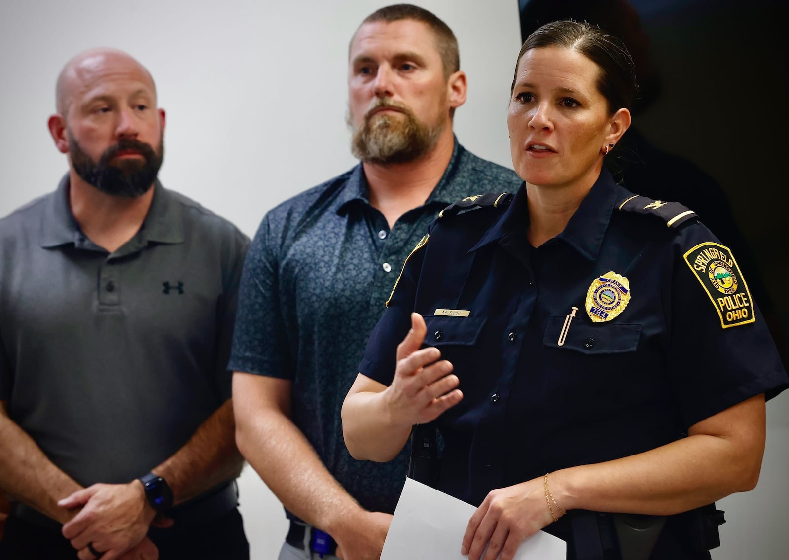 Springfield Police Chief Allison Elliott (right) speaks along with Deputy Director of Public Safety Jason Via and City Manager Bryan Heck at a press conference on a bomb threat to multiple locations across the city Thursday, Sept. 12, 2024. MARSHALL GORBY/STAFF