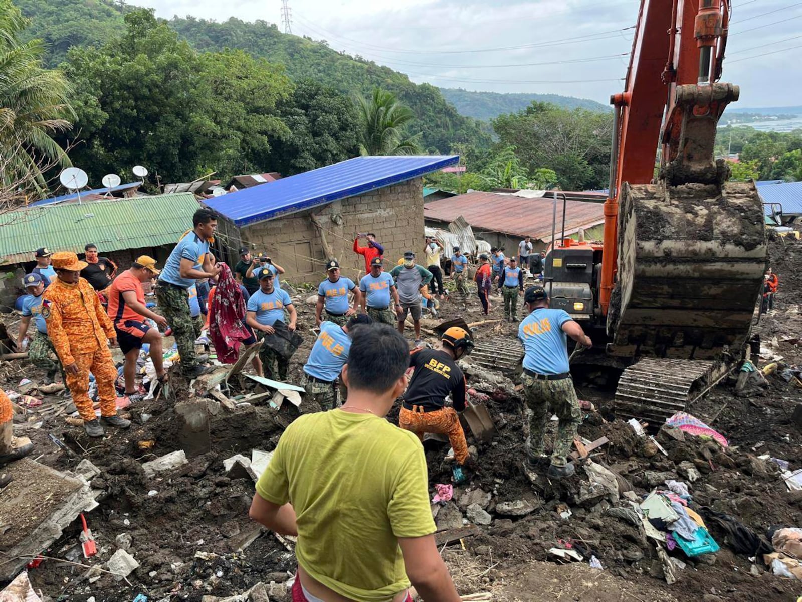 Volunteers continue rescue operations after a recent landslide triggered by Tropical Storm Trami struck Talisay, Batangas province, Philippines leaving thousands homeless and several villagers dead on Saturday, Oct. 26, 2024. (AP Photo/Jim Gomez)