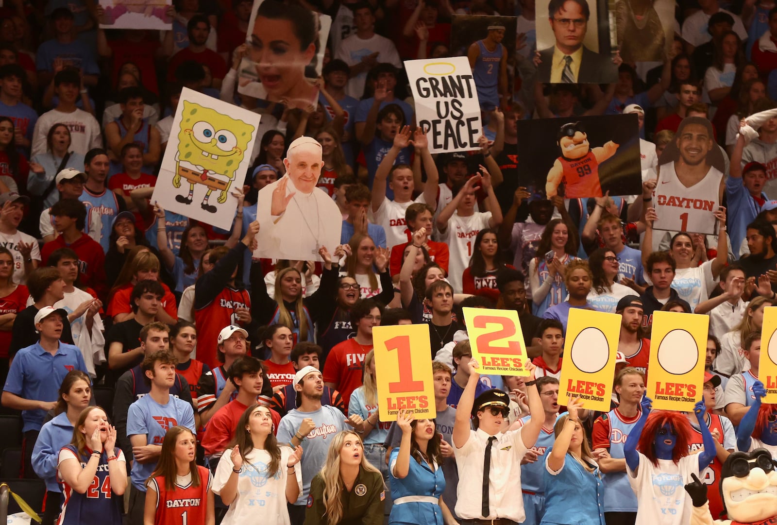 Dayton fans in the Red Scare student section cheer during an exhibition game against Xavier on Sunday, Oct. 20, 2024, at UD Arena. David Jablonski/Staff