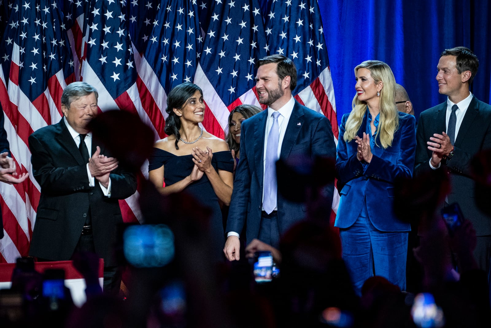 
                        Vice President-elect JD Vance is applauded during an election night event at the Palm Beach County Convention Center in West Palm Beach, Fla., early Wednesday, Nov. 6, 2024. The most striking thing about the crowd of family and supporters that President-elect Donald Trump brought onstage with him to make his victory speech on election night was that they looked as if they were attending a cocktail party rather than a historic political gathering. (Haiyun Jiang/The New York Times)
                      