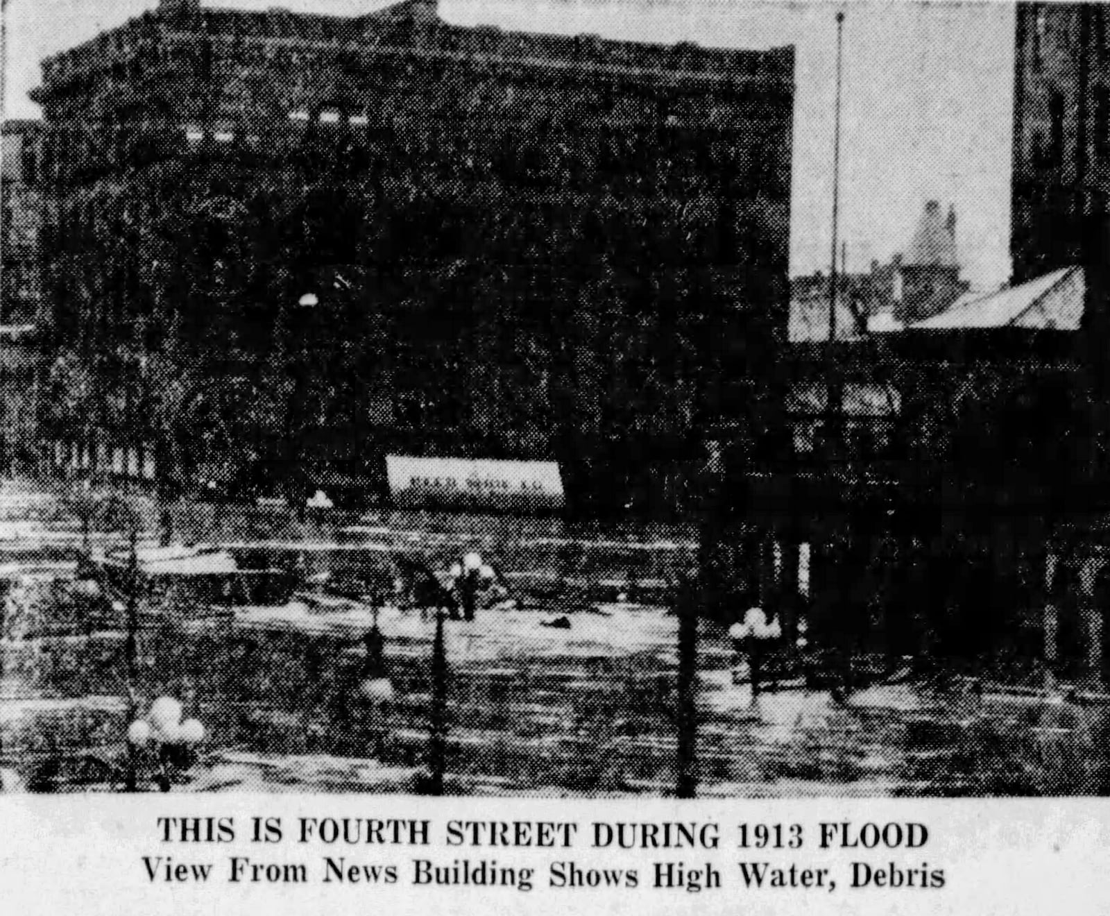 This is Fourth Street during the 1913 Flood. View from News Building shows high water, debris.