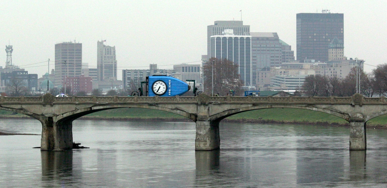 The Gem City Clock is taken across the Stewart Street bridge in 2006 en route to its new home at Carillon Historical Park. Staff Photo by Chris Stewart