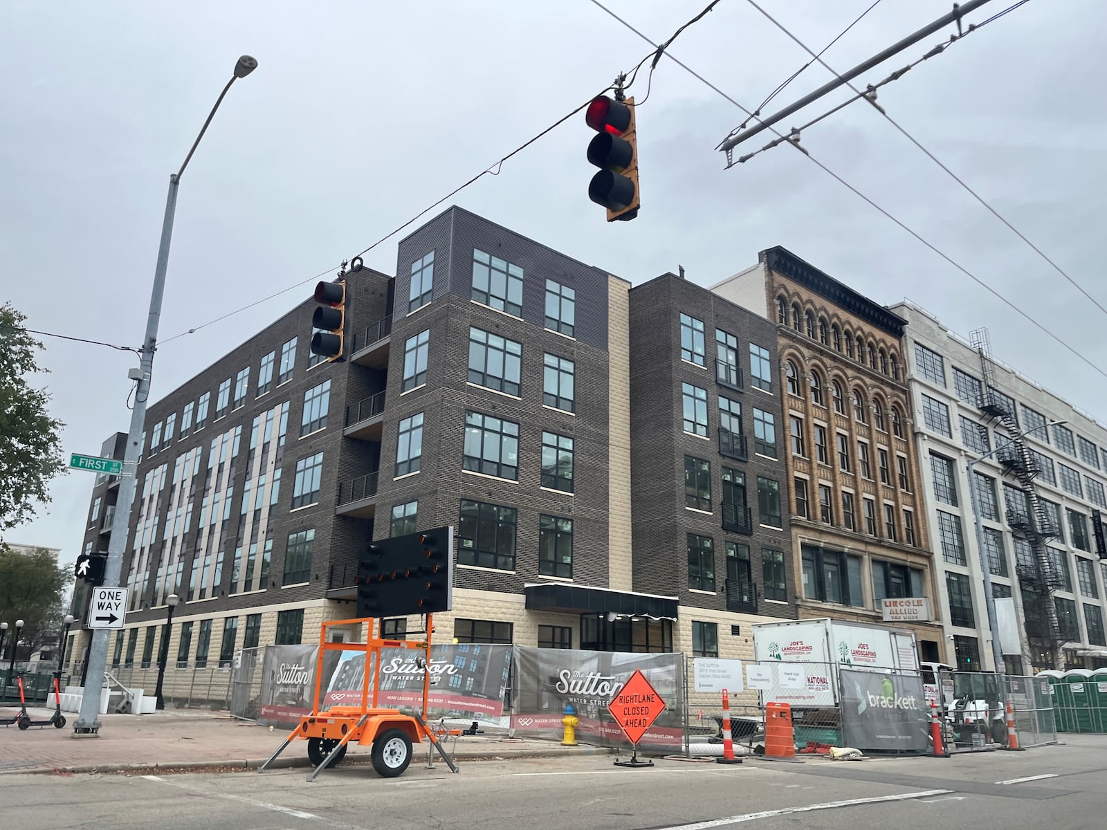 Work continues on the Sutton, a 71-unit apartment building in downtown Dayton being developed by  Water Street District developers Crawford Hoying and Woodard Development. The apartments are on the same block as Day Air Ballpark, where the Dayton Dragons play. CORNELIUS FROLIK / STAFF