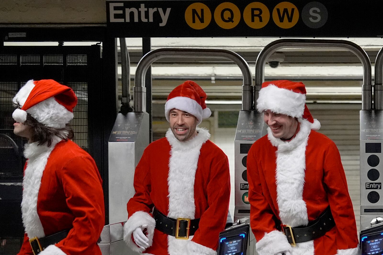 Revellers arrive to SantaCon on the subway, Saturday, Dec. 14, 2024, in New York. (AP Photo/Julia Demaree Nikhinson)