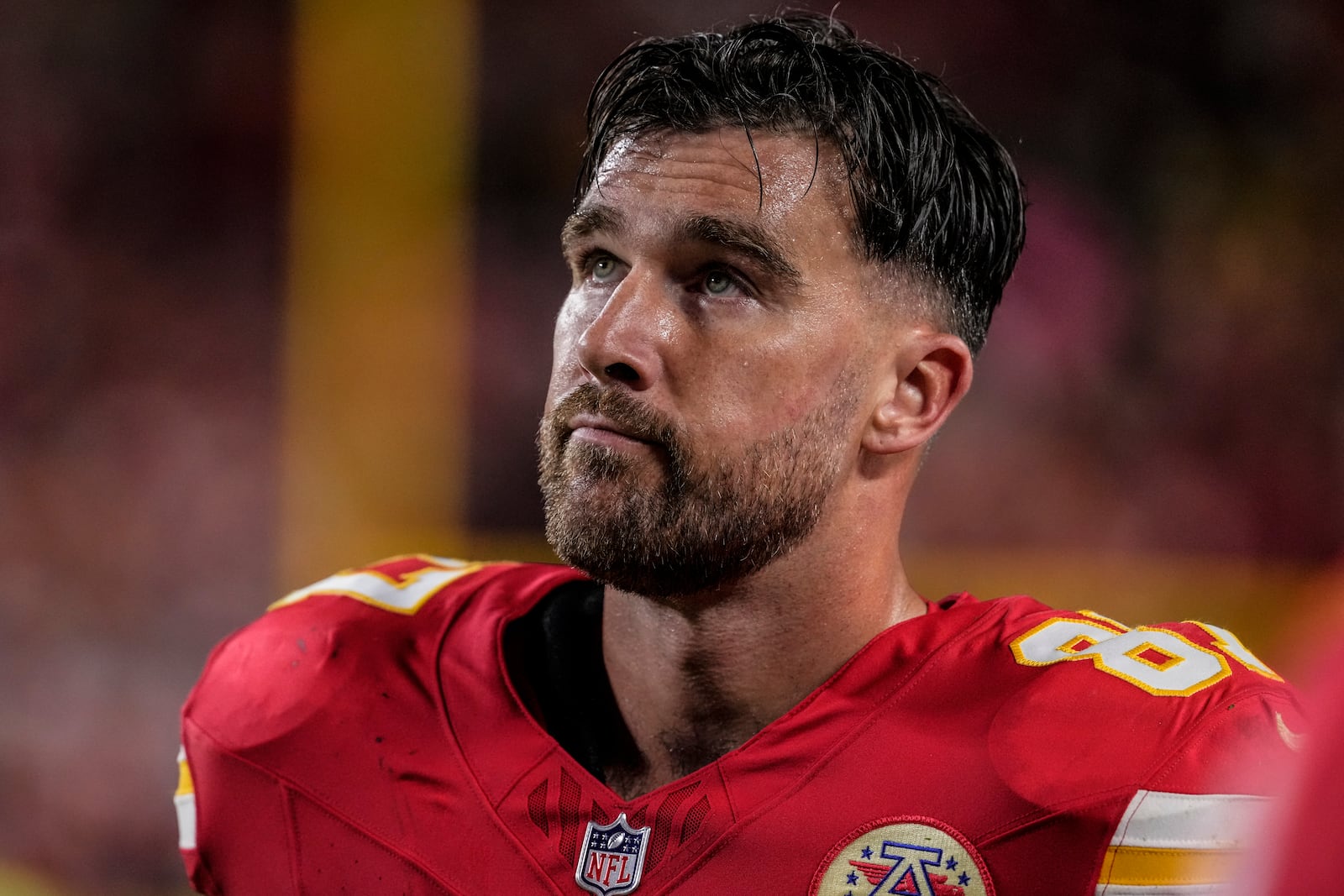 Kansas City Chiefs tight end Travis Kelce (87) watches play against the Tampa Bay Buccaneers during the second half of an NFL football game, Monday, Nov. 4, 2024, in Kansas City, Mo. (AP Photo/Ed Zurga)