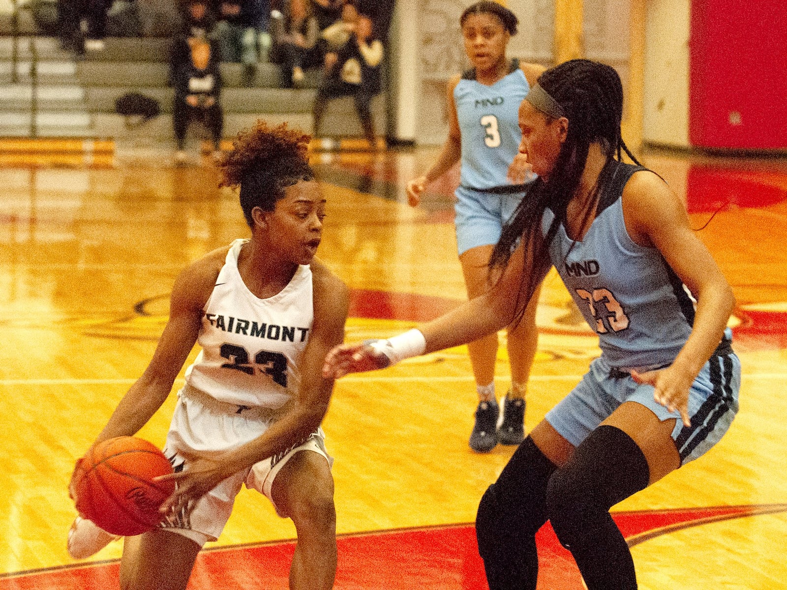 Fairmont senior Makira Webster tries to get past Mount Notre Dame’s Autumn Crockett during the Firebirds’ 47-41 loss Saturday in the Division I region final at Princeton High School. Jeff Gilbert/CONTRIBUTED