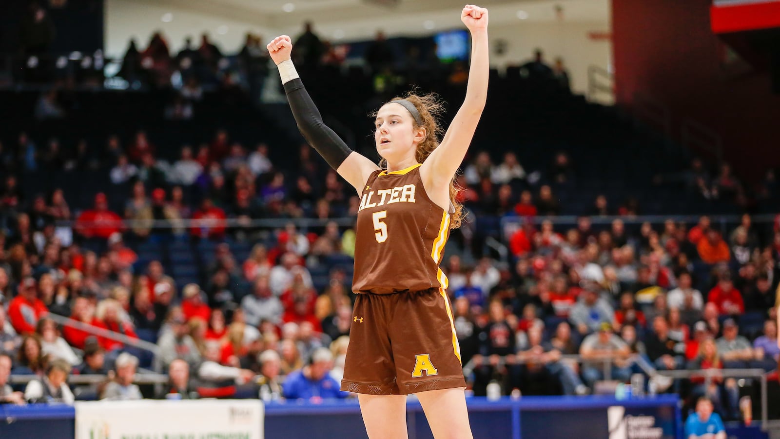 Alter High School senior Caraline Kernan raises her fists in the air in celebration after giving her team a 16-point lead late in the fourth quarter during the Division II state championship game on Saturday afternoon at UD Arena. CONTRIBUTED PHOTO BY MICHAEL COOPER