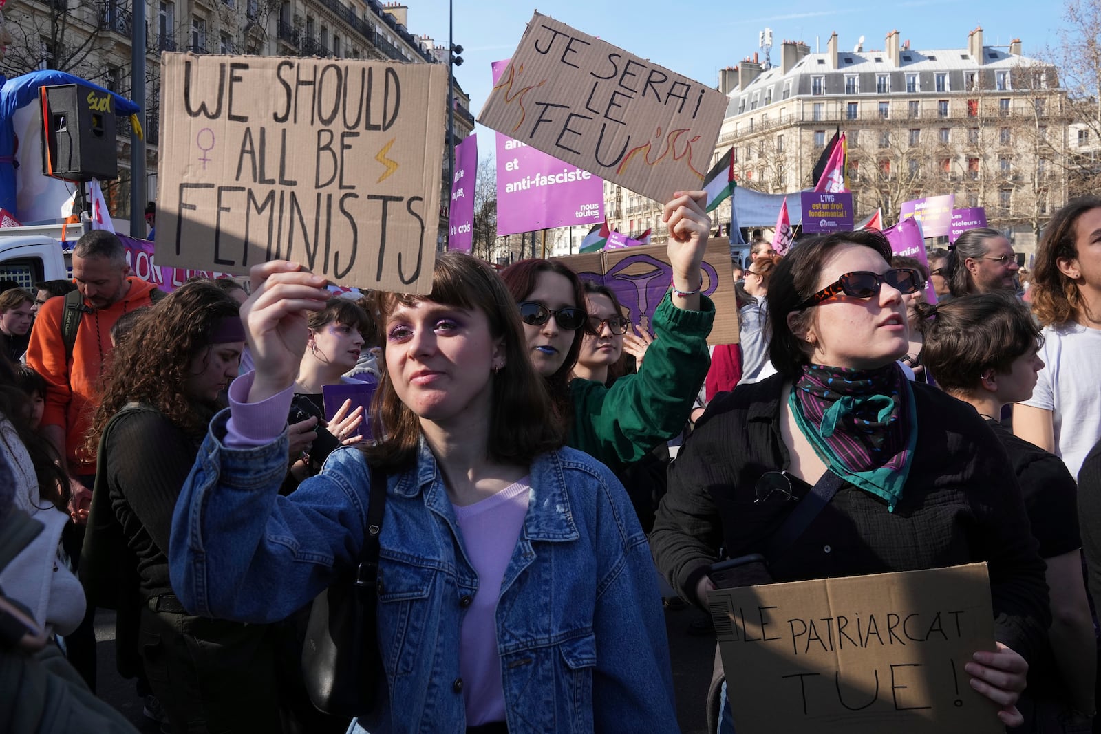 Women take part in a march to mark International Women's Day in Paris, Saturday March 8,, 2025. (AP Photo/Michel Euler)