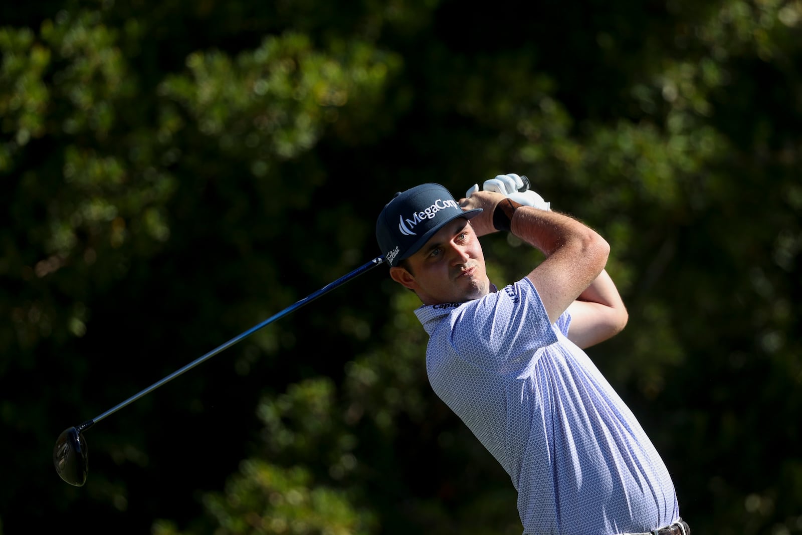 J.T. Poston hits off the tee on the third hole during the final round of the Shriners Children's Open golf tournament, Sunday, Oct. 20, 2024, in Las Vegas. (AP Photo/Ian Maule)