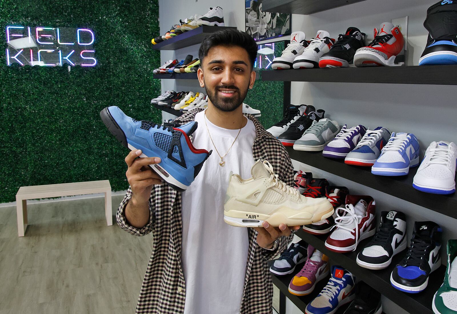 Paavan Patel in his new Springfield business, Field Kicks, a buy, sell and trade sneaker store located on North Plum Street Tuesday, April 9, 2024. BILL LACKEY/STAFF