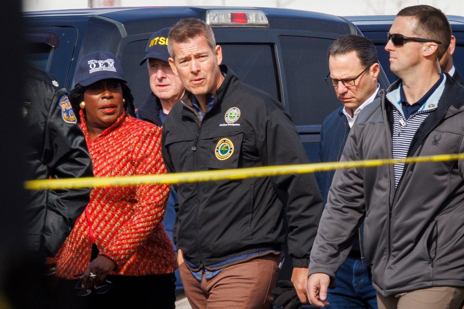 From left; Philadelphia Mayor Cherelle Parker, United States Secretary of Transportation Sean Patrick Duffy, and Pennsylvania Governor Josh Shapiro tour the Friday night crash scene of a medical transport jet Monday morning Feb. 3, 2025, in Philadelphia. (Alejandro A. Alvarez /The Philadelphia Inquirer via AP)