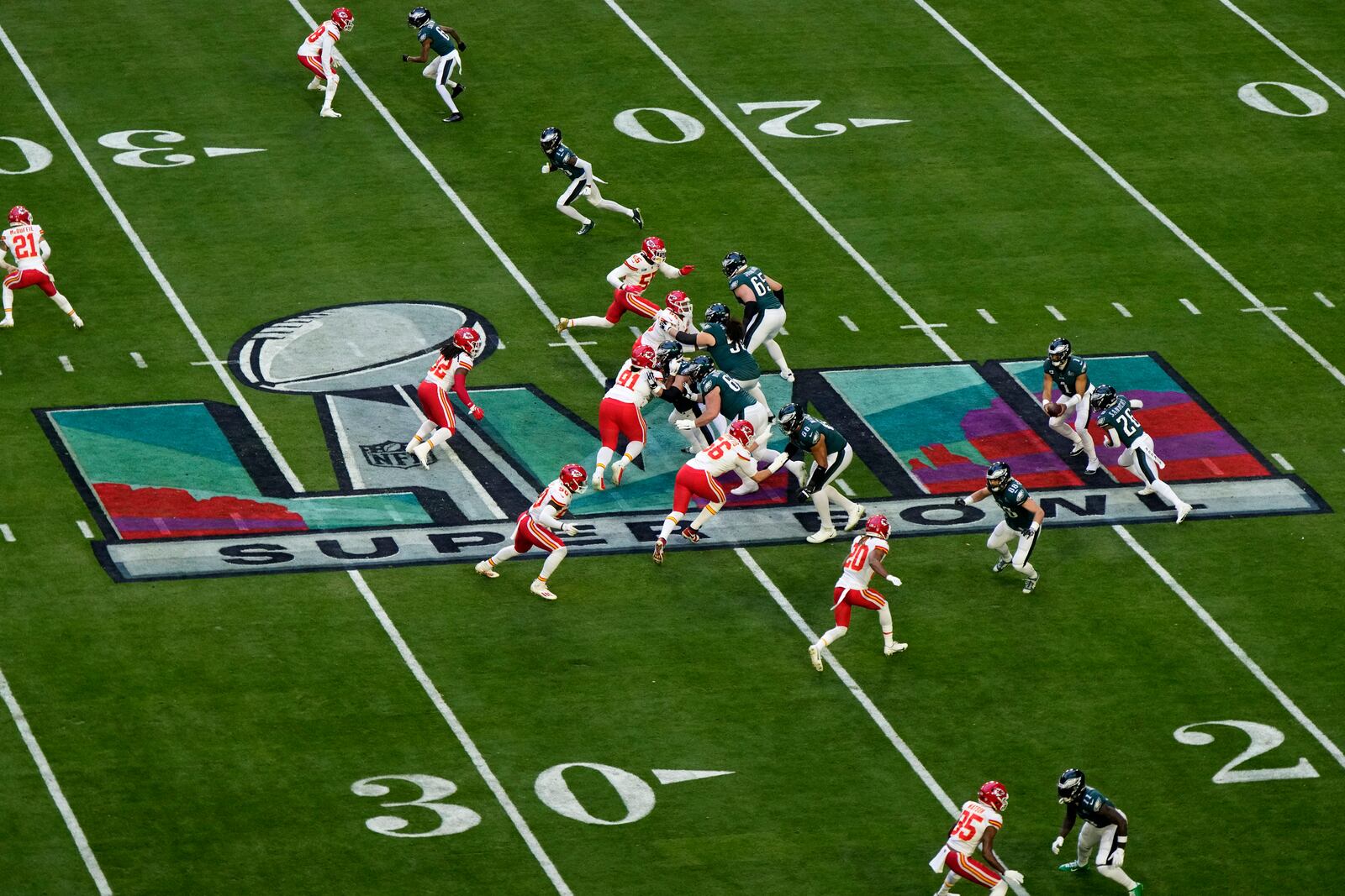 FILE - Philadelphia Eagles quarterback Jalen Hurts (1) hands off to running back Miles Sanders (26) during the first half of the NFL Super Bowl 57 football game against the Kansas City Chiefs, Sunday, Feb. 12, 2023, in Glendale, Ariz. (AP Photo/Charlie Riedel, File)