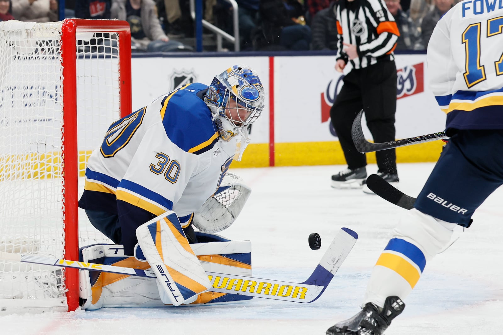 St. Louis Blues' Joel Hofer makes a save against the Columbus Blue Jackets' during the second period of an NHL hockey game Saturday, Jan. 4, 2025, in Columbus, Ohio. (AP Photo/Jay LaPrete)