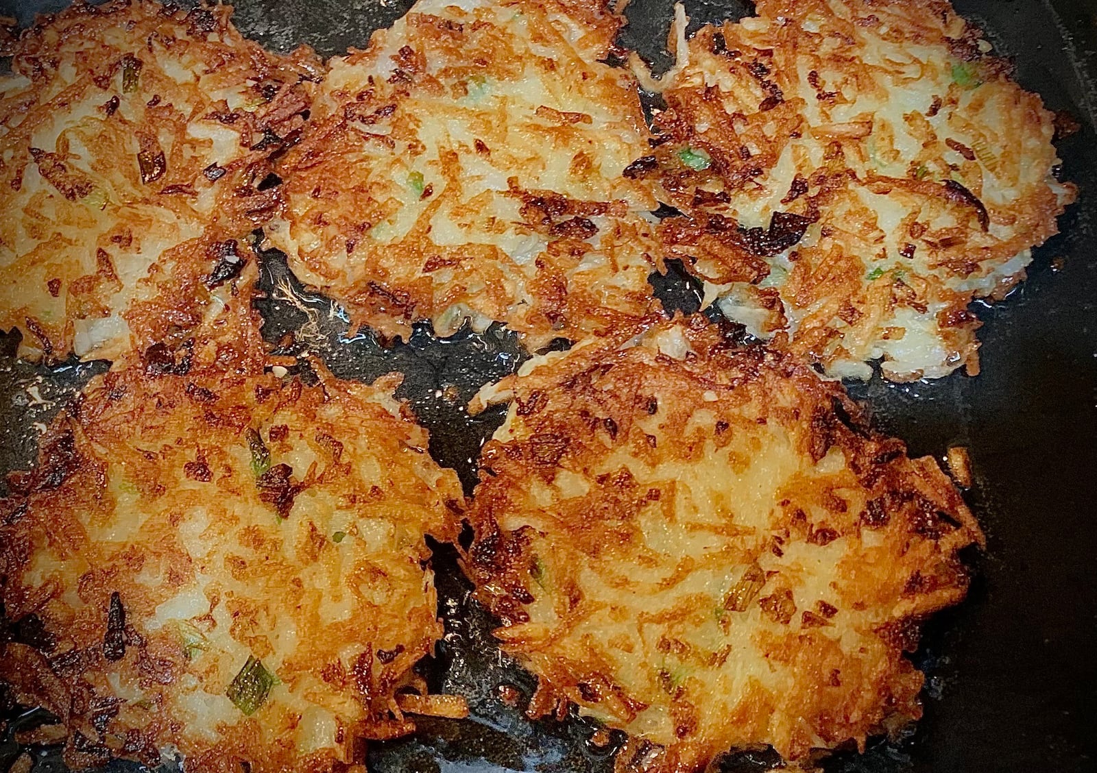 Cathy Gardner says her guests would form a line for "hot out of the pan latkes'' when she hosted an annual Hanukkah party in her hometown in Florida. MARSHALL GORBY\STAFF