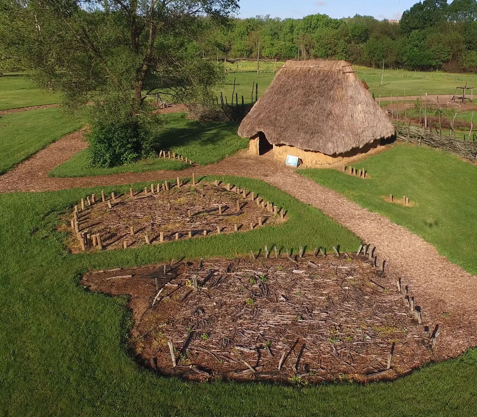 Recreated lath and mud daub structures with grass thatched roofs stand in the exact same location as the originals.  The SunWatch Indian Village/Archaeological Park is nestled in mature trees along the Great Miami River south of Dayton.    TY GREENLEES / STAFF