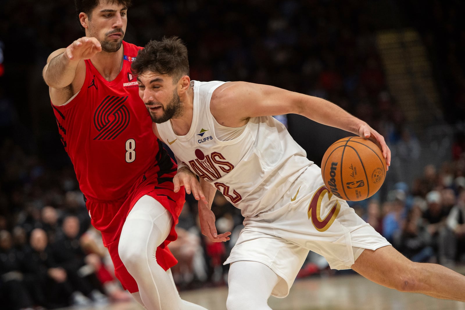 Cleveland Cavaliers' Ty Jerome (2) drives as Portland Trail Blazers' Deni Avdija (8) defends during the second half of an NBA basketball game in Cleveland, Sunday, March 2, 2025. (AP Photo/Phil Long)