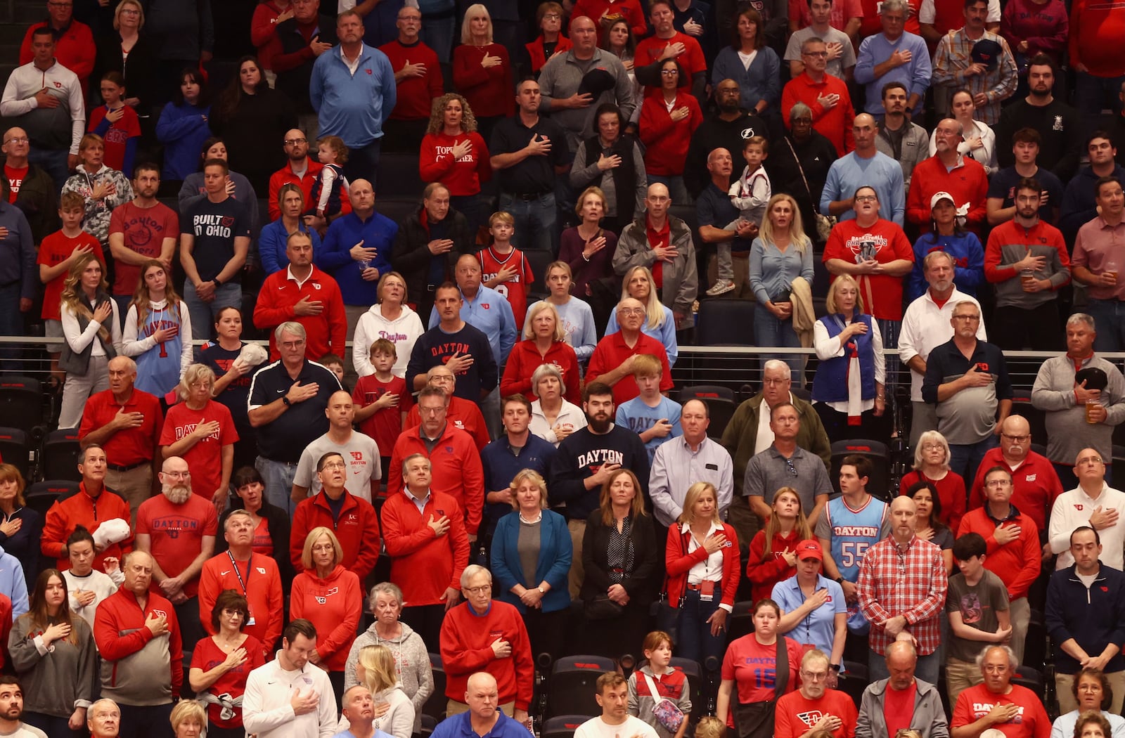 Dayton fans stand for the national anthem before a game against Saint Francis on Monday, Nov. 4, 2024, at UD Arena. David Jablonski/Staff