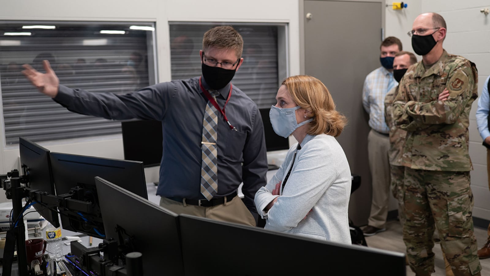 Air Force Research Laboratory Thermal Test Engineer and UES Inc. contractor Braden Childers (left) discusses thermal materials testing inside the control room of AFRL’s Laser-Hardened Materials Evaluation Laboratory with Deputy Secretary of Defense Dr. Kathleen H. Hicks, who visited Wright-Patterson Air Force Base on Aug. 17. Gen. Duke Richardson, commander of Air Force Materiel Command, watches the demonstration. U.S. AIR FORCE PHOTO/KEITH LEWIS