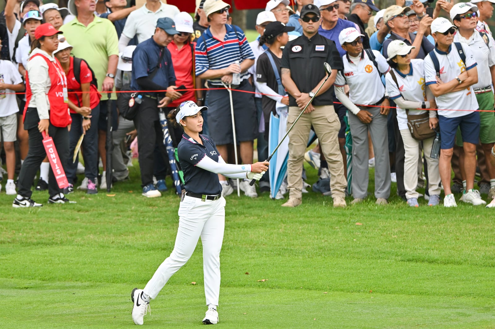 Atthaya Thitikul of Thailand hits second shot from the 1st fairway during the first round of the LPGA Honda Thailand golf tournament in Pattaya, southern Thailand, Thursday, Feb. 20, 2025. (AP Photo/Kittinun Rodsupan)