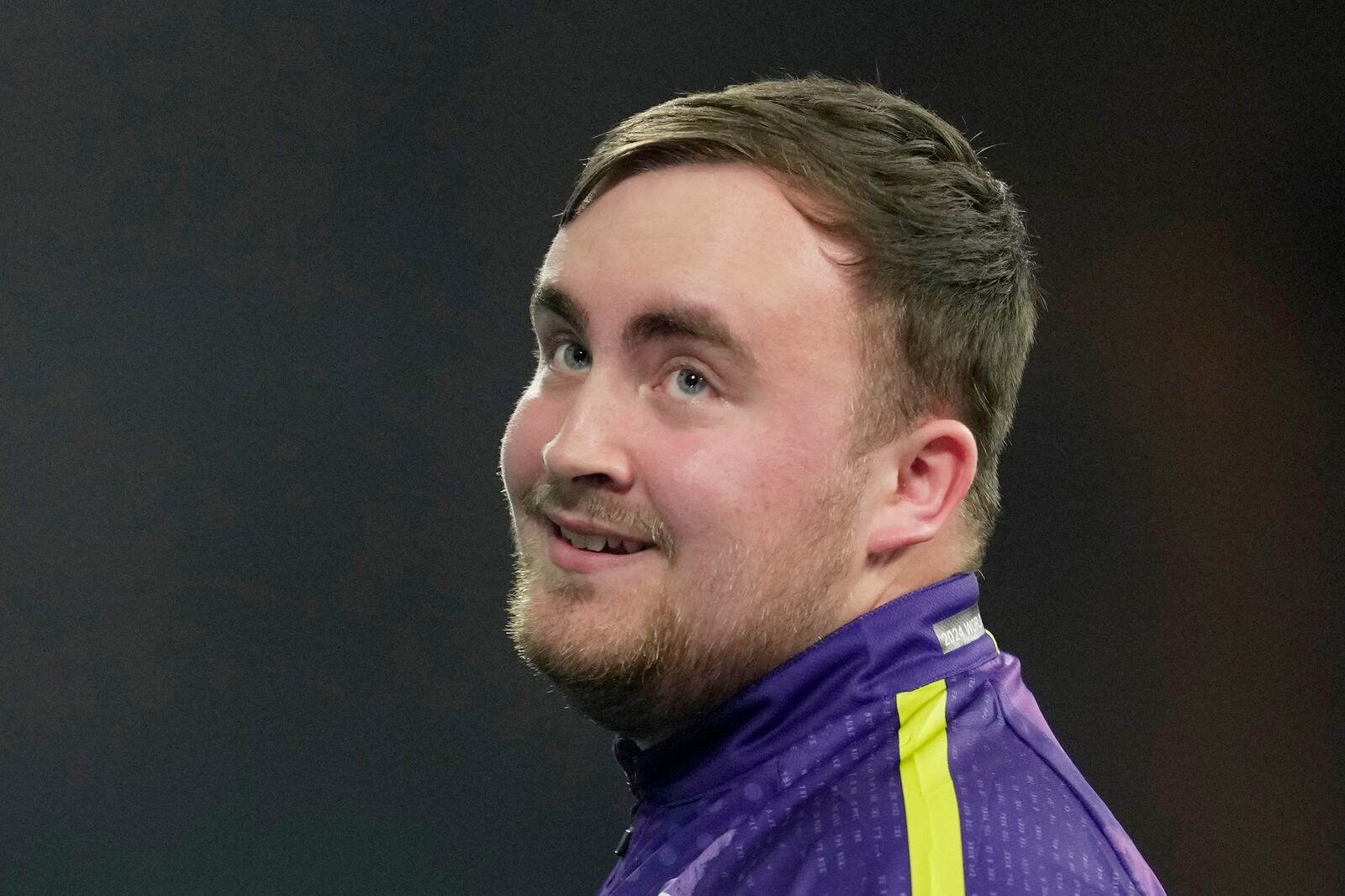 FILE - Luke Littler of England reacts during the semifinal match against Scott Williams of England at the World Darts Championship, in London, Tuesday, Jan. 2, 2024. (AP Photo/Kin Cheung, File)