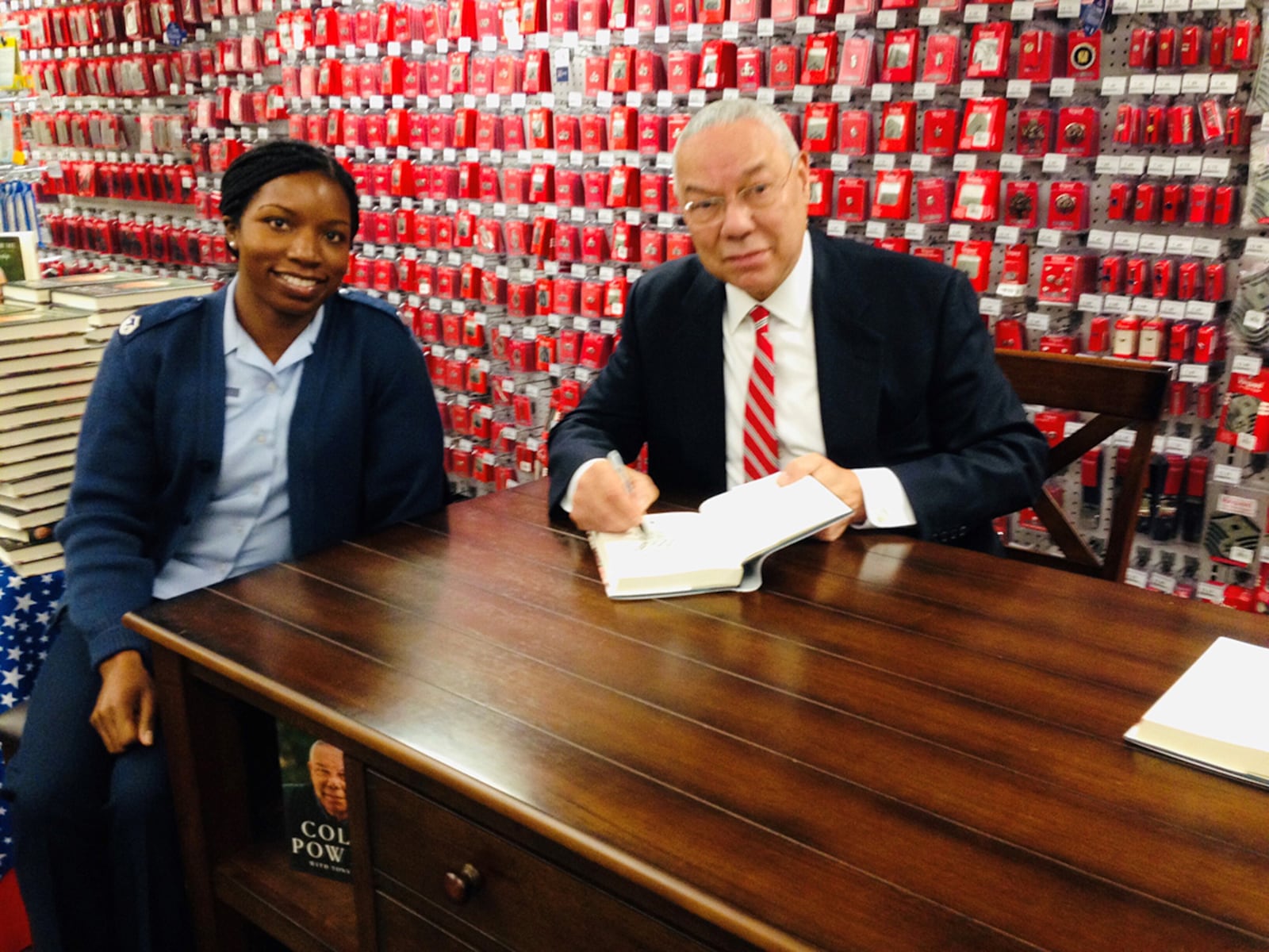 Retired Gen. Colin Powell signs a copy of his book, “It Worked for Me in Life and Leadership,” for Master Sgt. Sharma Haynes on Nov. 6, 2014. Haynes counts the late secretary of state among her career inspirations. CONTRIBUTED PHOTO