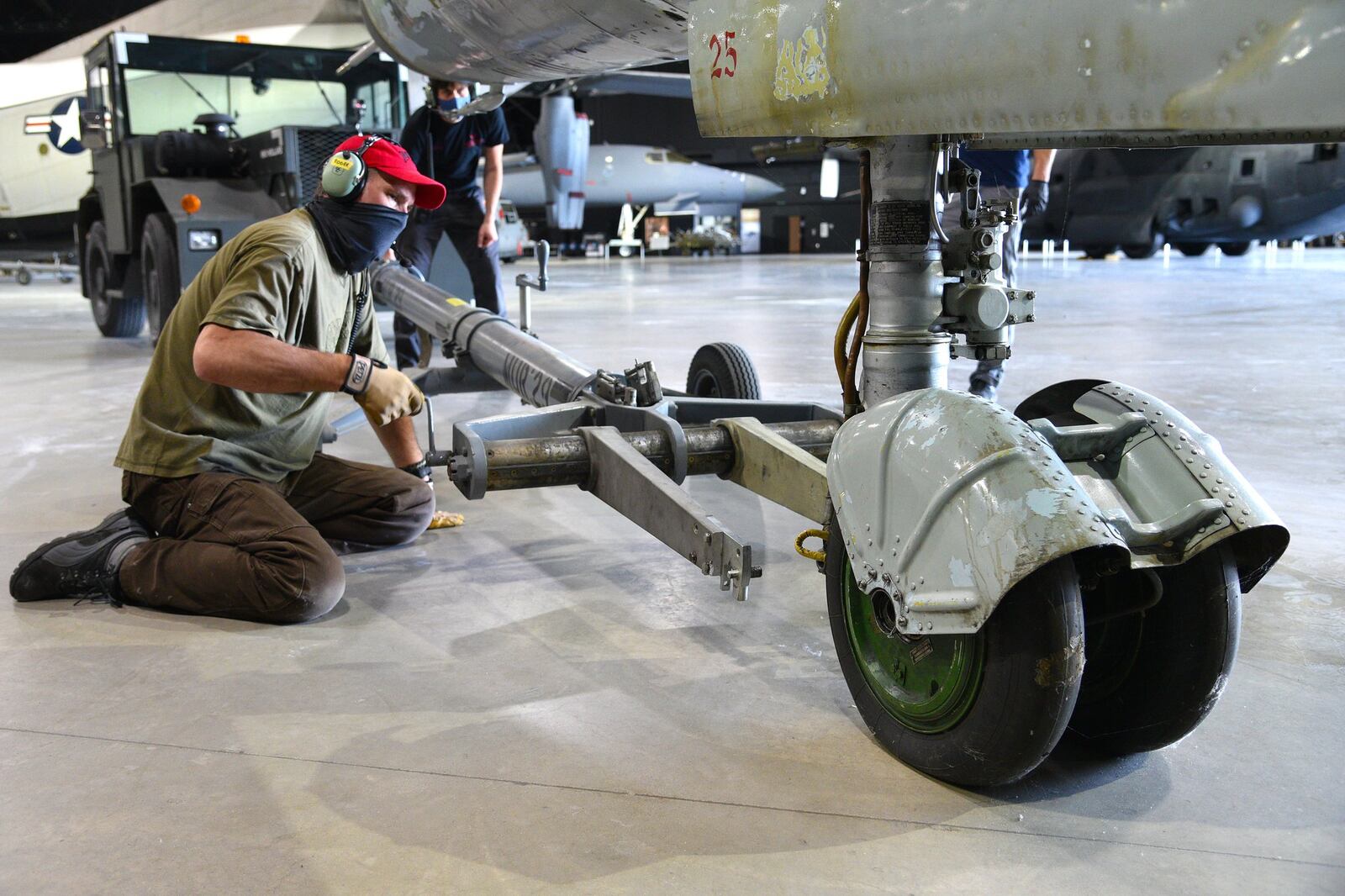 Museum restoration supervisor David Lazzarine attaches a tow bar to the Mikoyan-Gurevich MiG-23MS “Flogger-E” during the Cold War Gallery aircraft moves. CONTRIBUTED/U.S. AIR FORCE/KEN LAROCK