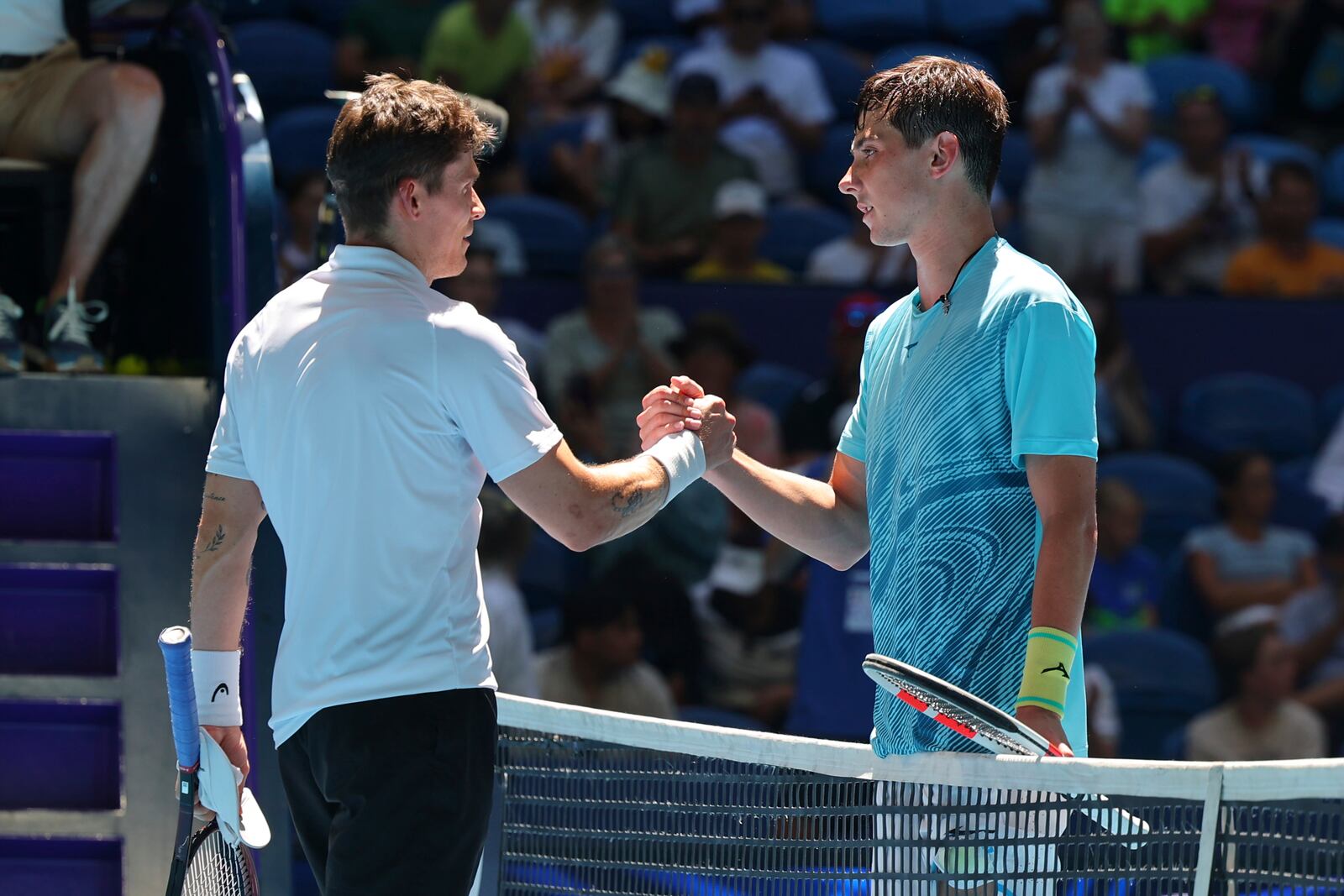 Alexander Shevchenko of Kazakhstan, right, shakes hands with Daniel Masur of Germany after winning their United Cup tennis match in Perth, Australia, Wednesday, Jan. 1, 2025. (AP Photo/Trevor Collens)