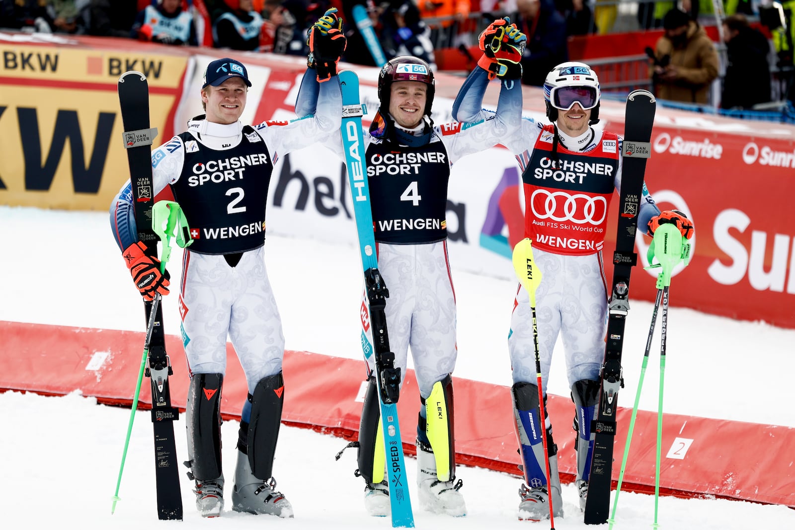 Norway's Atle Lie McGrath, center, winner of an alpine ski, men's World Cup slalom, celebrates with second-placed Norway's Timon Haugan, left, and third-placed Norway's Henrik Kristoffersen, in Wengen, Switzerland, Sunday, Jan. 19, 2025 (AP Photo/Gabriele Facciotti)