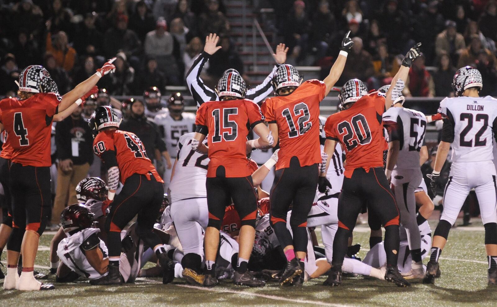 Fort Loramie’s Nick Brandewie (4), Mark Seger (15), Nathan Raterman (12) and Max Hoying (20) all signal a recovered fumble. McComb defeated Fort Loramie 28-14 in a D-VII high school football state semifinal at Wapakoneta on Saturday, Nov. 24, 2018. MARC PENDLETON / STAFF