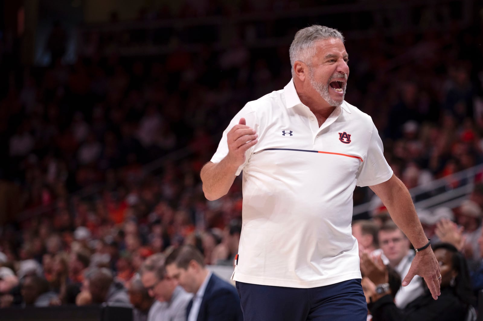 Auburn head coach Bruce Pearl yells at the bench during the second half of an NCAA college basketball game against Ohio State, Saturday, Dec. 14, 2024, in Atlanta. (AP Photo/Kathryn Skeean)