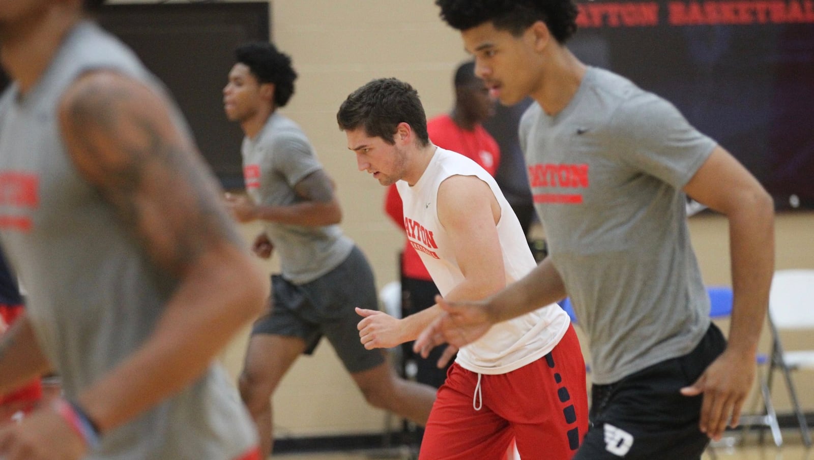 Dayton’s Jack Westerfield, center, warms up before practice on Sept. 26, 2018, at the Cronin Center. David Jablonski/Staff