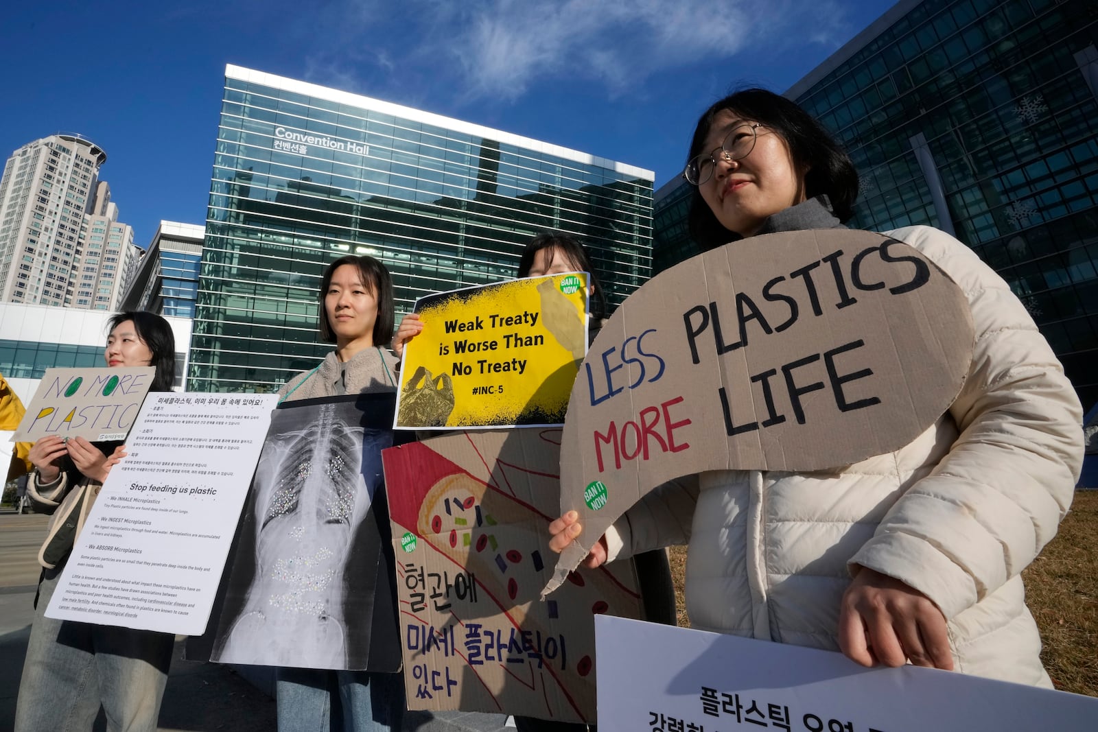 South Korean environment activists protest calling for a strong global plastics treaty outside of the venue for the fifth session of the Intergovernmental Negotiating Committee on Plastic Pollution in Busan, South Korea, Sunday, Dec. 1, 2024. (AP Photo/Ahn Young-joon)