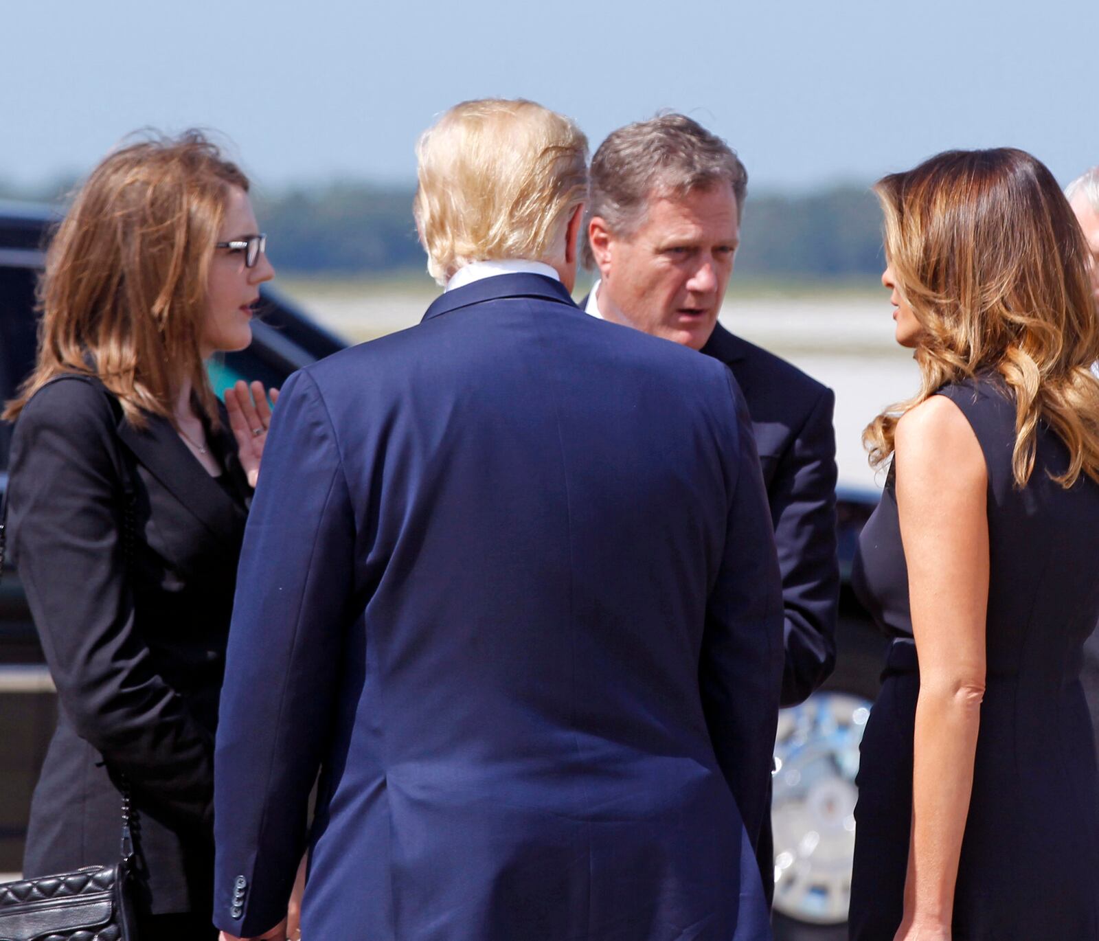 President Trump and First Lady Melania Trump greeted Congressman Mike Turner (R) and his daughter Jessica Turner at Wright-Patterson Air Force Base, Wednesday, Aug. 7, 2019, in Dayton, Ohio. Trump is in Dayton to visit with families of victims of the mass shooting that took place here on Sunday.(Ty Greenlees/Dayton Daily News/pool)