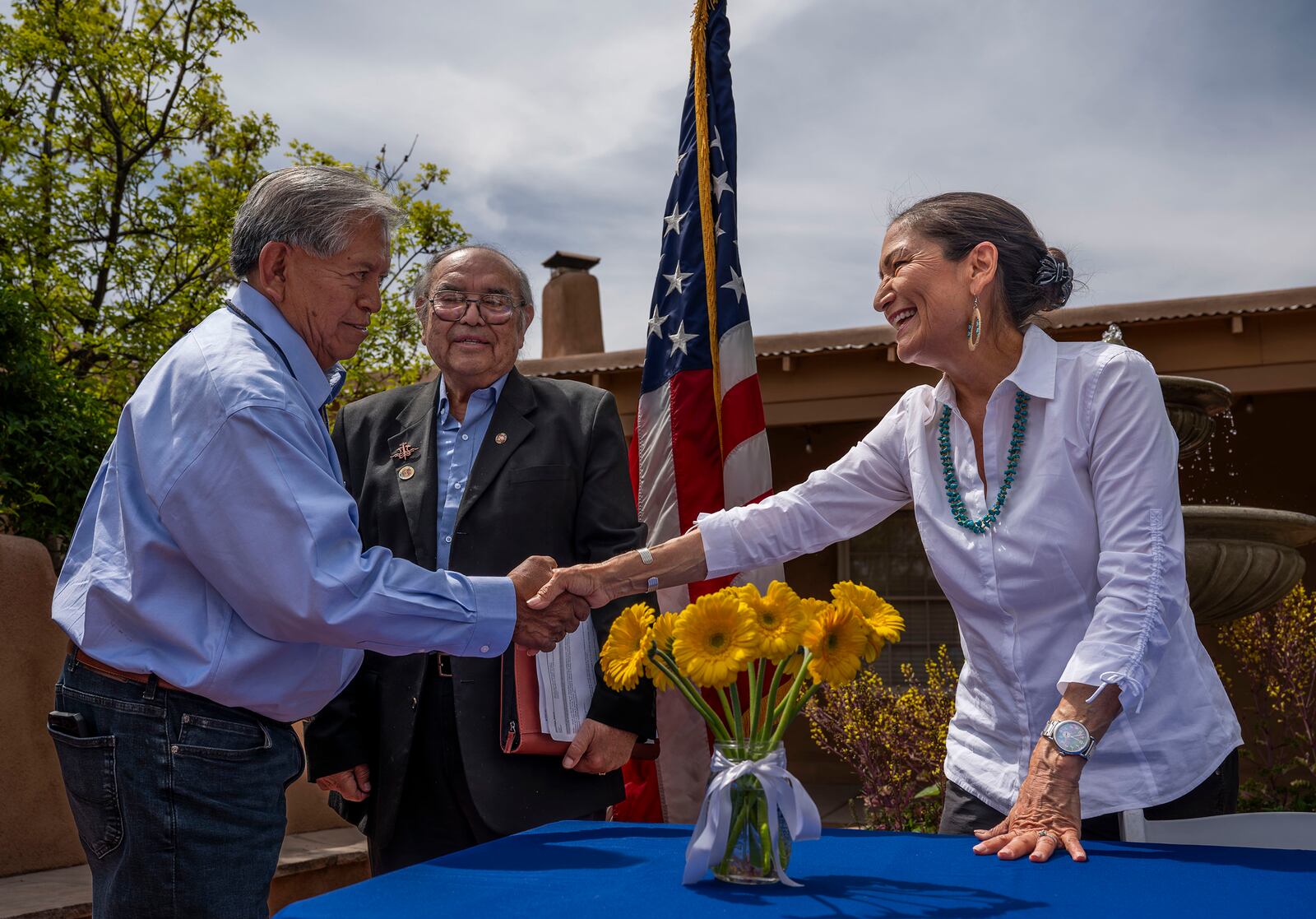 FILE - Interior Secretary Deb Haaland shakes hands with Gov. Myron Armijo of Santa Ana Pueblo after signing Public Land Order 7940, which protects more than 4,200 acres of Bureau of Land Management-managed public lands that is sacred to Tribes in the Placitas area, during a community event at El Zócalo Plaza in Bernalillo, N.M., Thursday, April 18, 2024. (Chancey Bush/The Albuquerque Journal via AP, File)